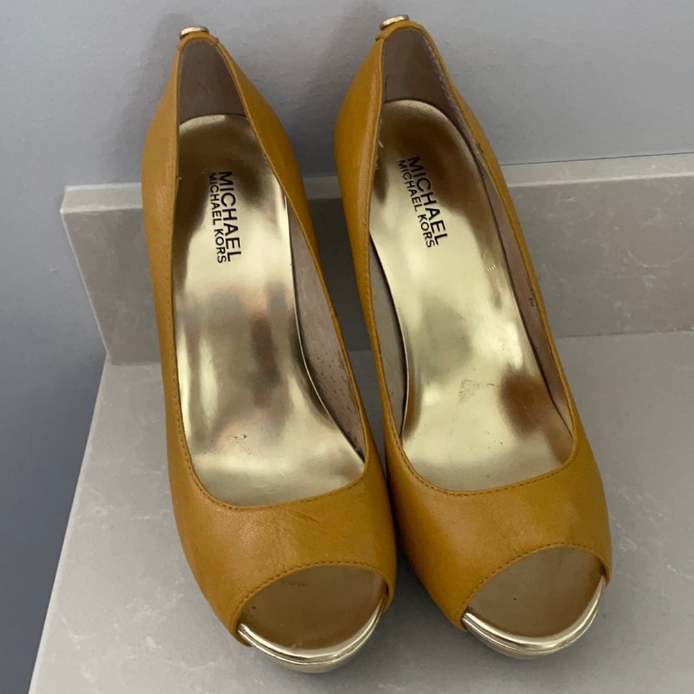 Yellow/gold Michael Kors platform high heels.